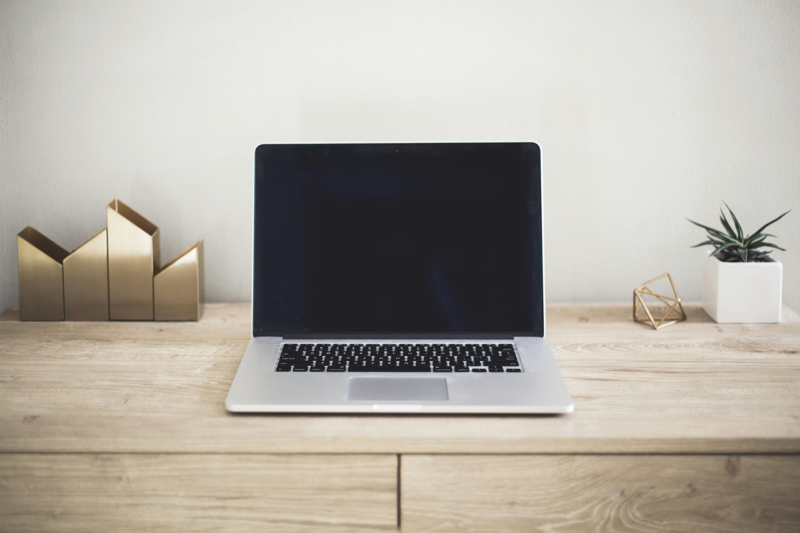 Budget laptop for college students open on a desk with notes