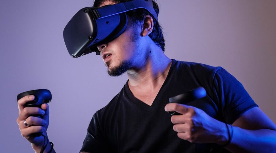 Person wearing a VR headset with motion controllers in a VR headset for beginners guide