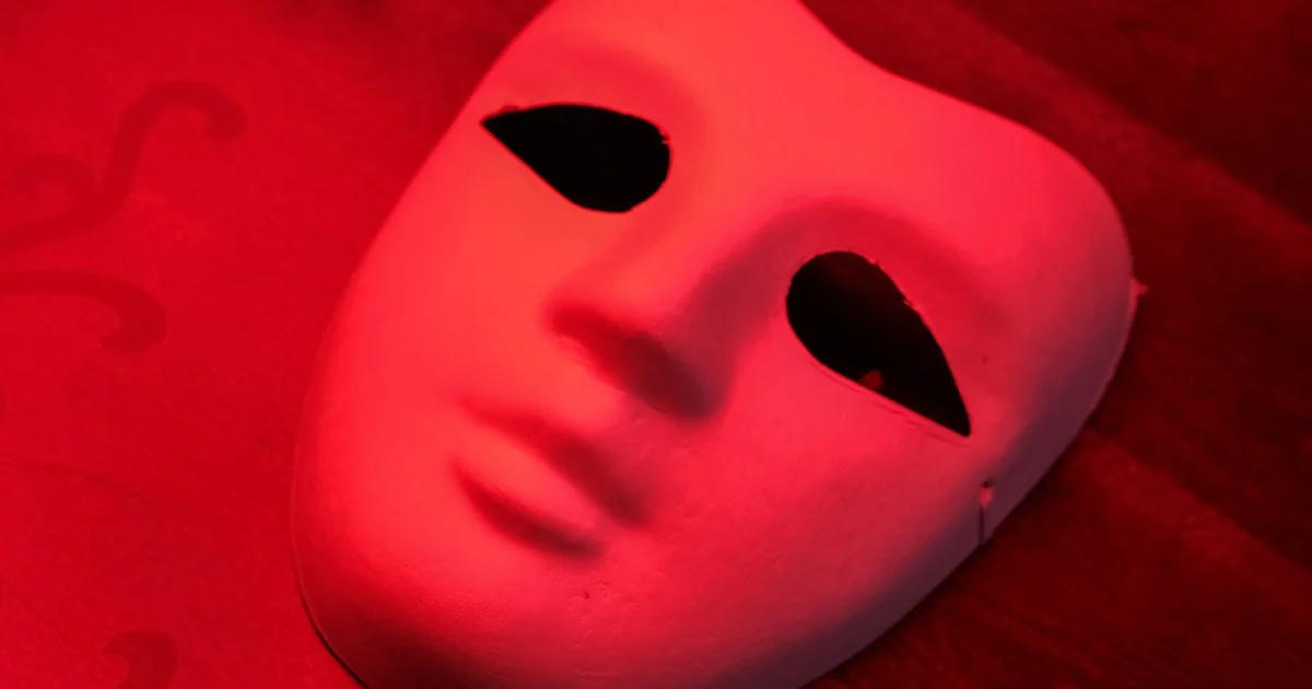 Rigid LED face mask illuminated in red light therapy mode