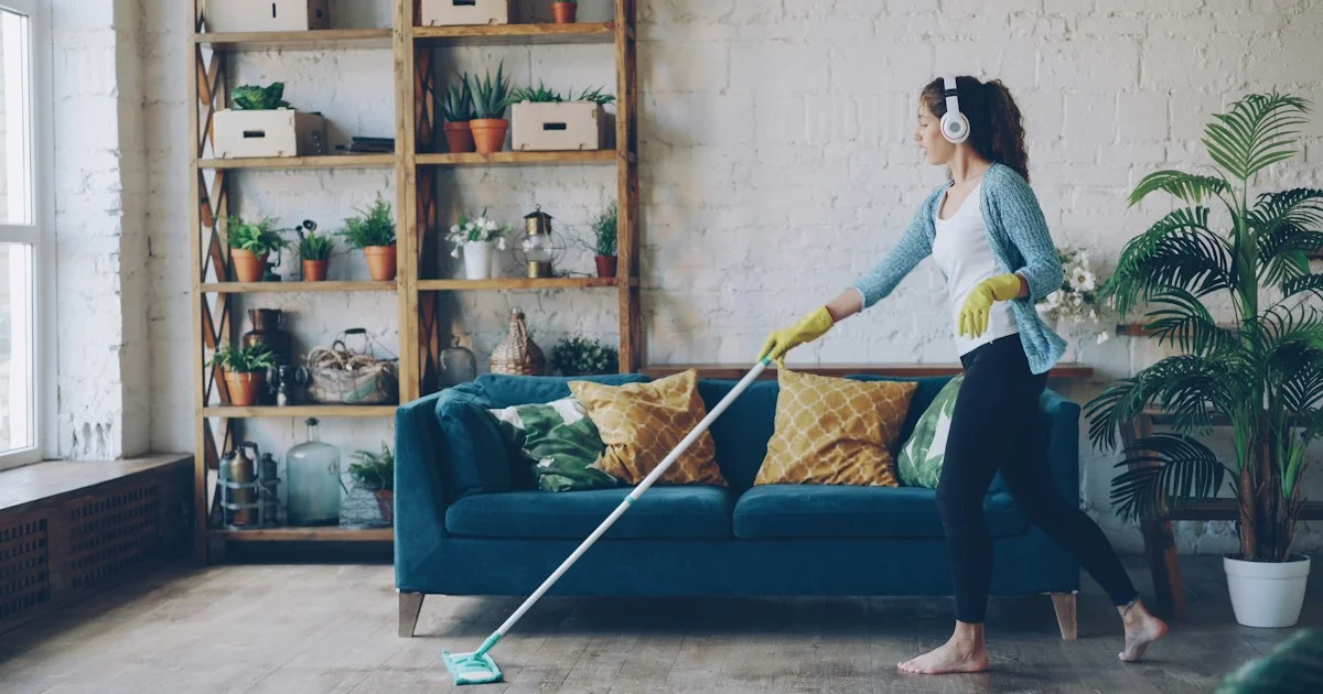 A person mopping a hard living room floor, the everyday job a top steam mop 2026 purchase has to improve on
