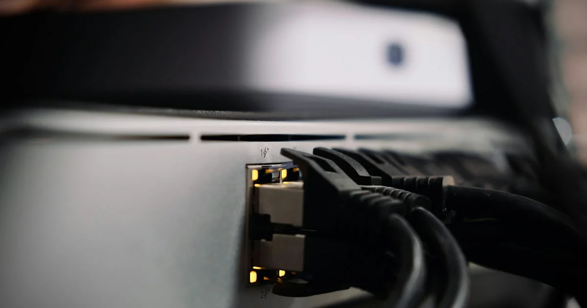 Network cables plugged into the back of a home network device, the infrastructure every best Sonos smart speaker 2026 choice depends on
