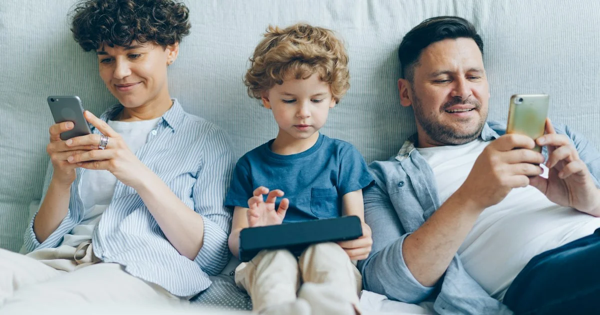 Three household members each using a separate phone or tablet, the people count that decides how to choose a multi device antivirus